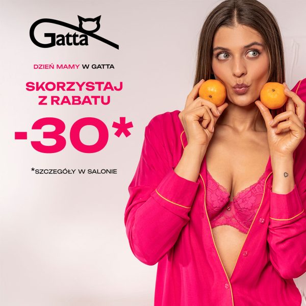 Kobieta w różowej koszuli nocnej trzyma mandarynki przy oczach Gatta Galeria Echo